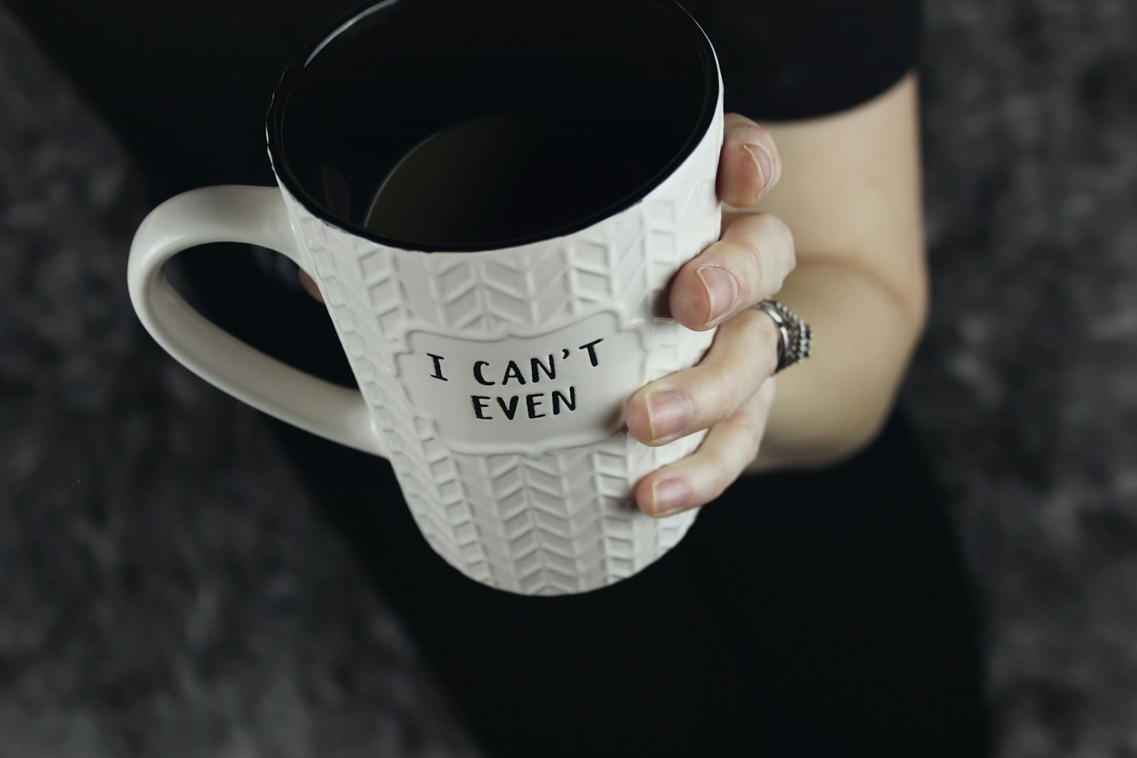 Photo by Jen Theodore a woman's hand grasps a white and black mug that says " I Can't Even" Hormonal imbalances and liver health concerns can ruin your day doesn't fit on the mug