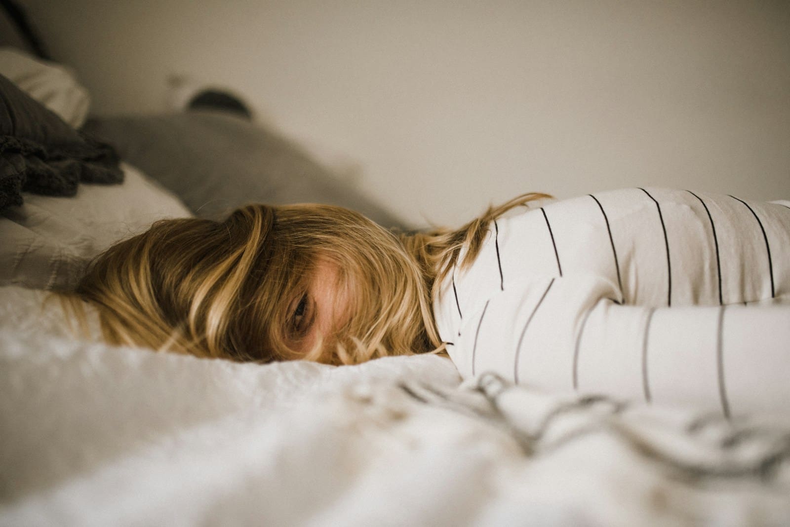 Photo by Kinga Howard woman lying on bed