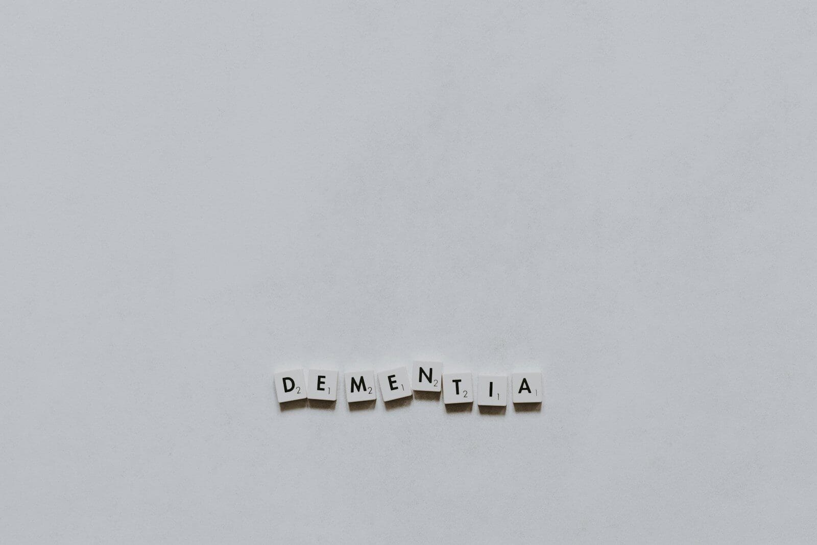 Photo by Pawel Czerwinski scrabble letters spell out dementia on a white background. There are steps you can take to prevent dementia every day.
